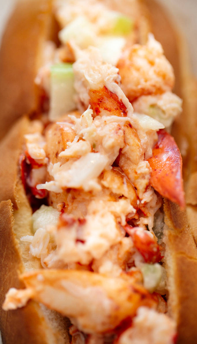 Lobster roll-lobster meat and celery on toasted roll is a common mean found on Cape Cod